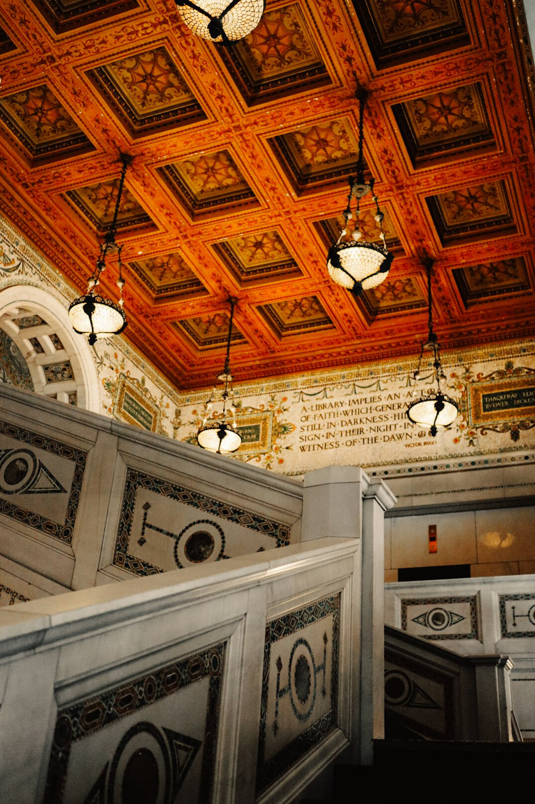 Grand historic library hall with arched ceiling and shelves